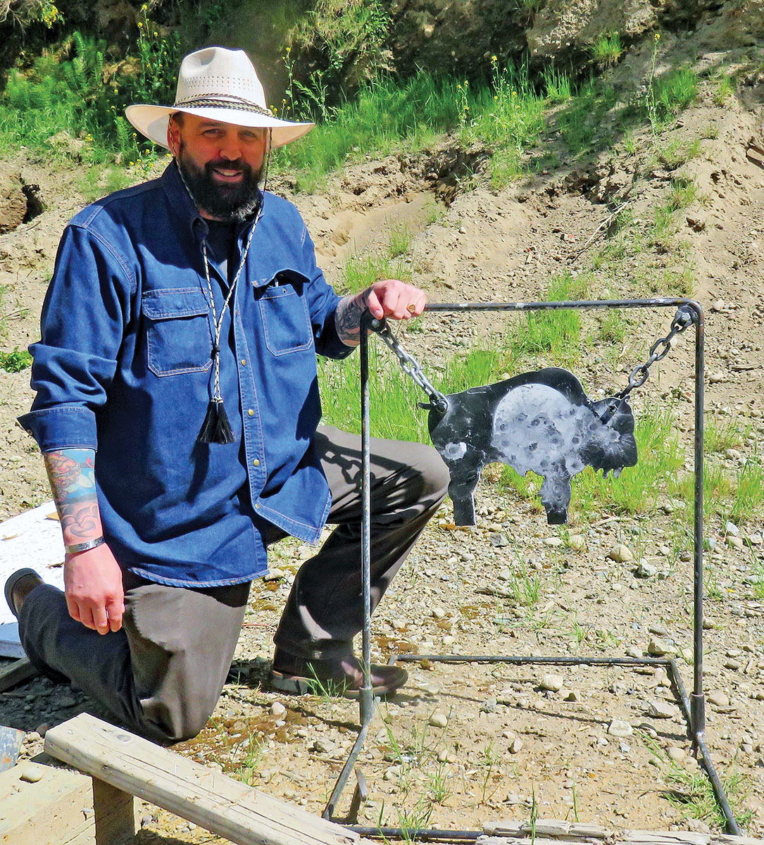 Wes Davis kneels beside the “buffalo” which is a small target for shots from 200 yards.